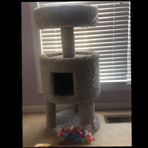 There are 22 cat toys and one cat tree